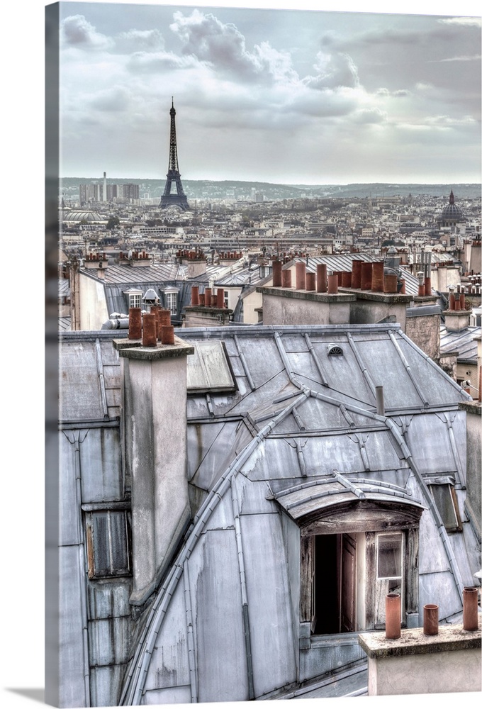 Photograph of the roof tops of Paris, France with the Eiffel Tower in the distance.