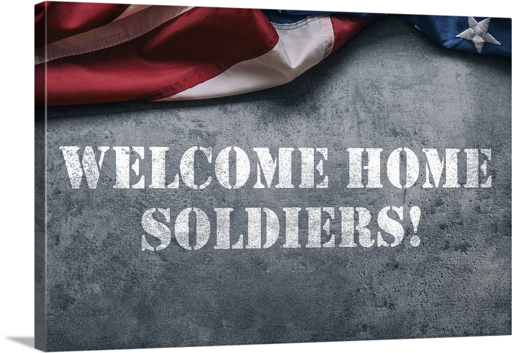 "Welcome Home Soldiers!" stenciled in white with an American flag above it.