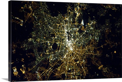 Berlin at night, from space. The light bulbs still show the East/West division.