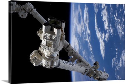 Canadarm, the Earth, and the tiny crescent Moon - a still life