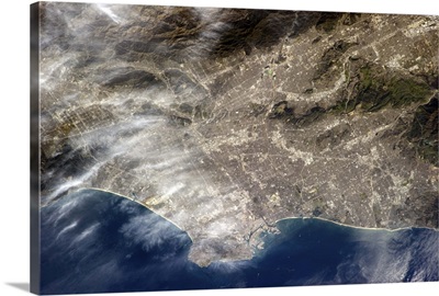 Los Angeles, CA. The grey of pavement and dense population is visible from Earth orbit