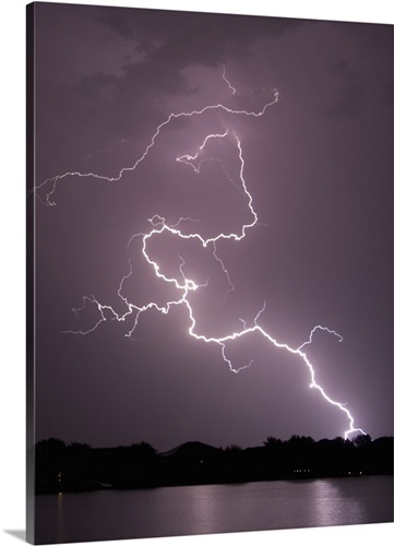 lightning striking ground near residential lake wall art canvas