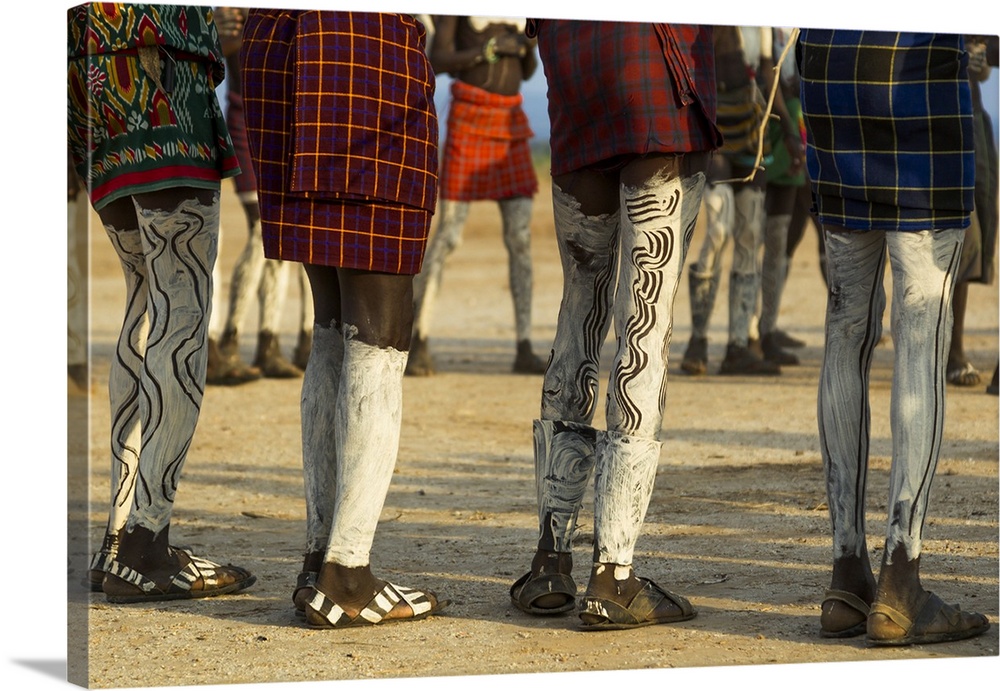 Africa, Ethiopia, Southern Omo Valley, Nyangaton Tribe.  Nyangaton men are decorated and dressed for a dance.