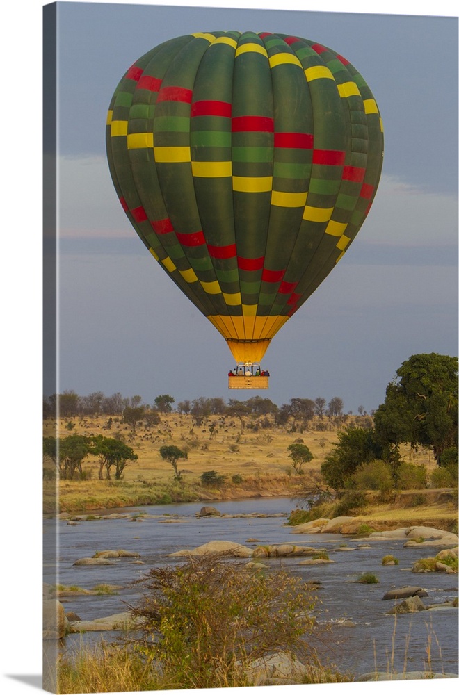 Africa. Tanzania. Hot air balloon crossing the Mara river in Serengeti NP.