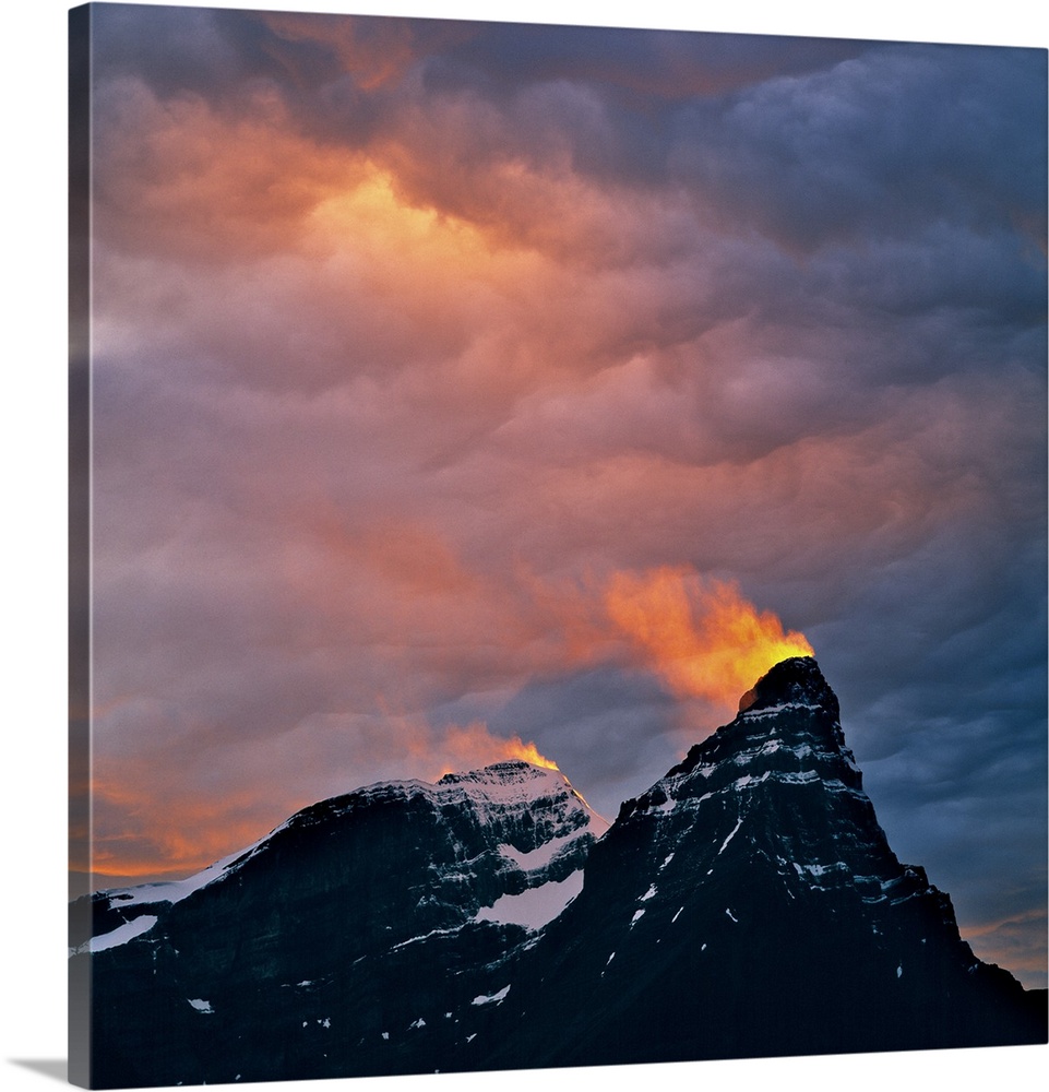 Canada, Alberta, Mt. Chephren. A snow plume catches light from the setting sun on Mt. Cephron Banff NP, a World Heritage S...