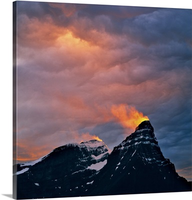 Alberta, A snow plume catches light from the sunset on Mt. Cephron, Banff National Park