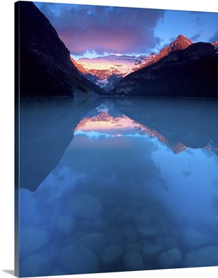 Alberta, Banff National Park, Sunrise reflects Victoria Glacier on Lake Louise