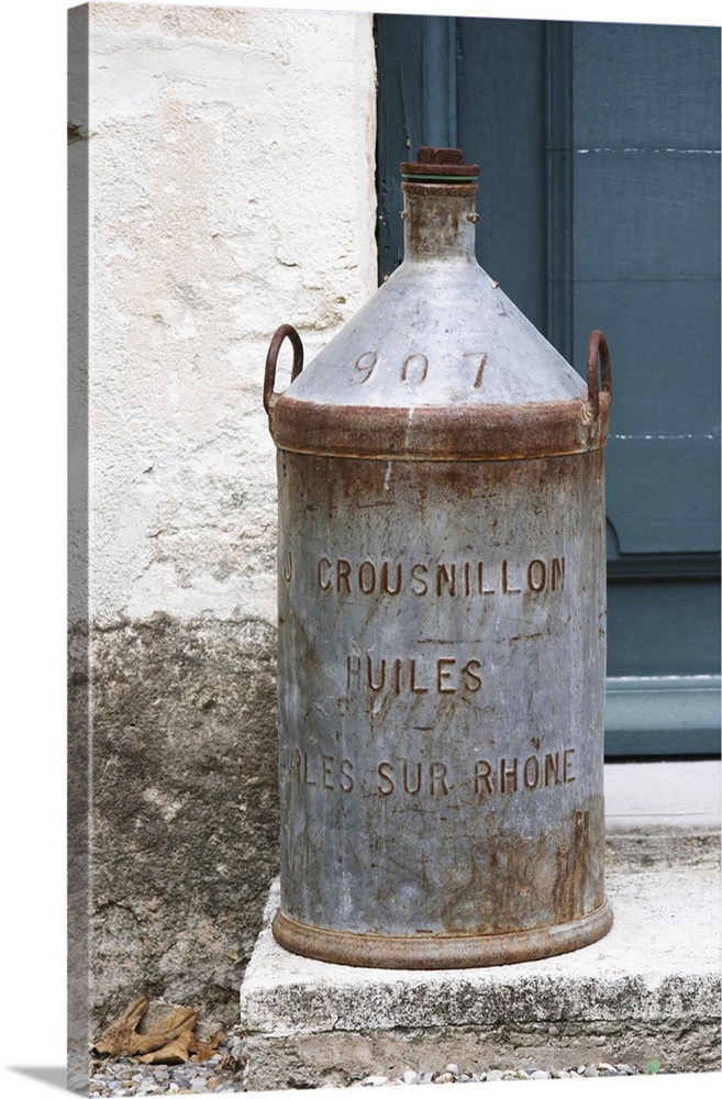 An old tin jar for transporting olive oil Crousnillon Huiles.  Moulin Mas des Barres olive mill, Maussanes les Alpilles, B...