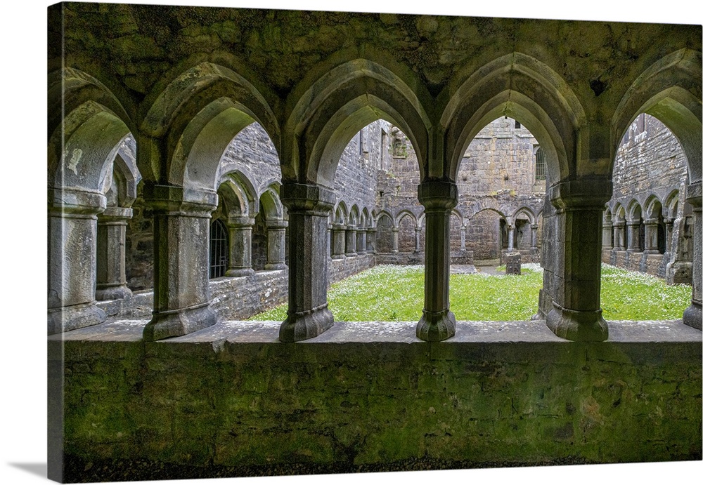 Ancient cloisters surround this patch of grass at Moyne Abbey, County Mayo, Ireland.