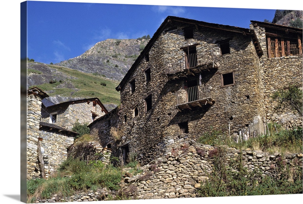 Europe, Andorra. Crumbling stone walls dot the hillsides in Andorra.