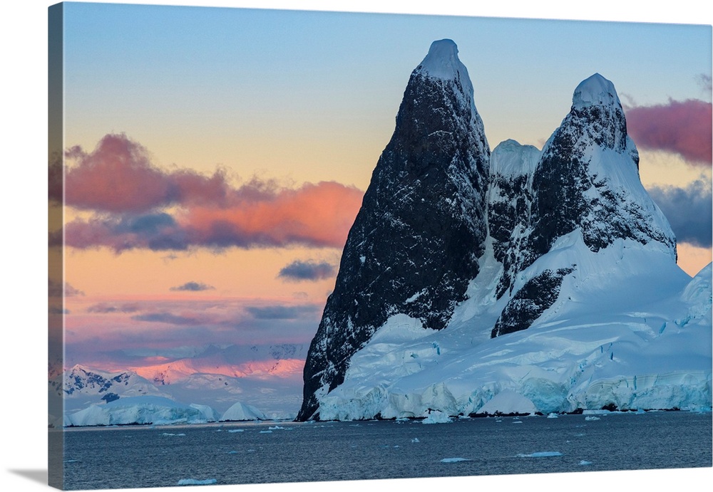 Antarctic Peninsula, Antarctica, Lemaire Channel. Una Peaks at sunset.
