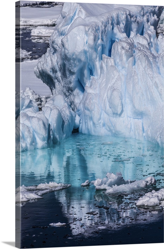 Antarctica. Colorful Iceberg and Sea Ice.