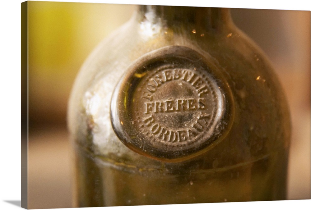 An old antique dusty wine bottle with a moulded seal on the shoulder of the bottle, probably early 19 century, seal showin...