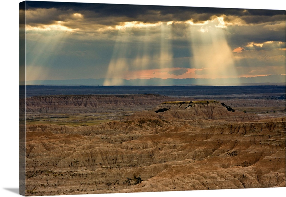approaching storm and crepuscular rays, sunset, Pinnacles Viewpoint, Badlands National Park, South Dakota, USA