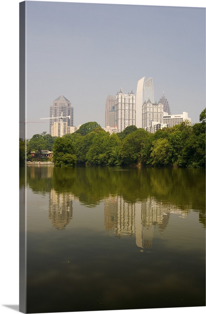 North America, USA, Georgia, Atlanta. Atlanta skyline and its reflection seen in a pond at Piedmont Park.