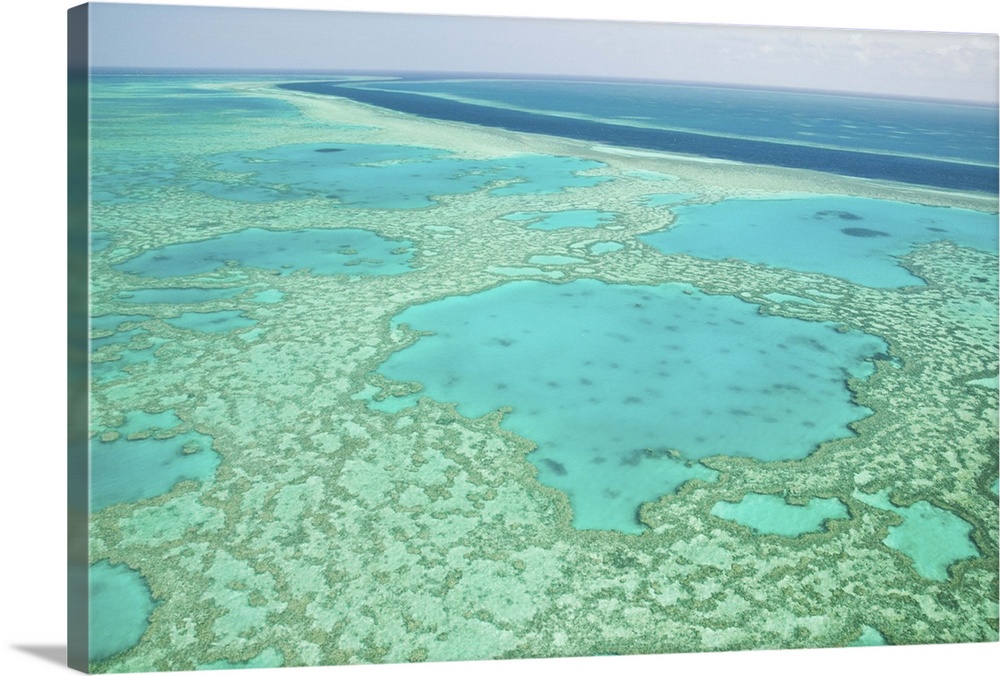 AUSTRALIA, Queensland, Whitsunday Coast, Great Barrier Reef. Aerial of the Great Barrier Reef by the Whitsunday Coast with...