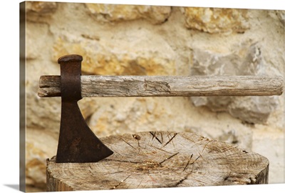 Ax struck in a chopped up piece of wood chopping board, Provence, France