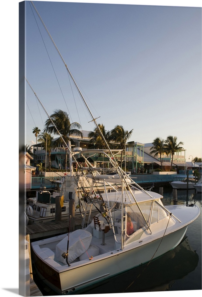 Bahamas, Grand Bahama Island, Freeport, Setting sun lights power boats at marina near Our Lucaya Resort