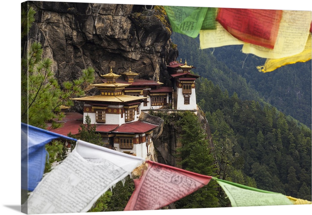 Bhutan, Paro. Taktsang Monastery, known as 'Tiger's Nest' hangs on the cliffs.