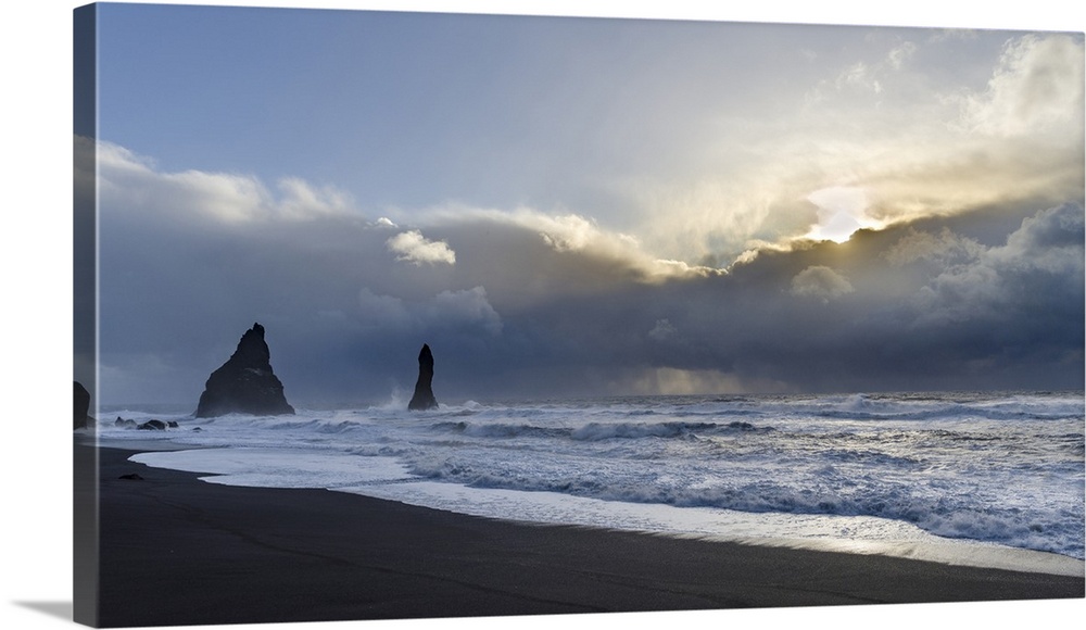 Coast near Vik i Myrdal during winter. Black volcanic beach Reynisfjara with the Reynisdrangar sea stacks, Iceland.