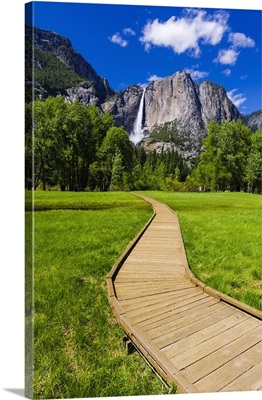 Boardwalk through meadow under Yosemite Falls, California