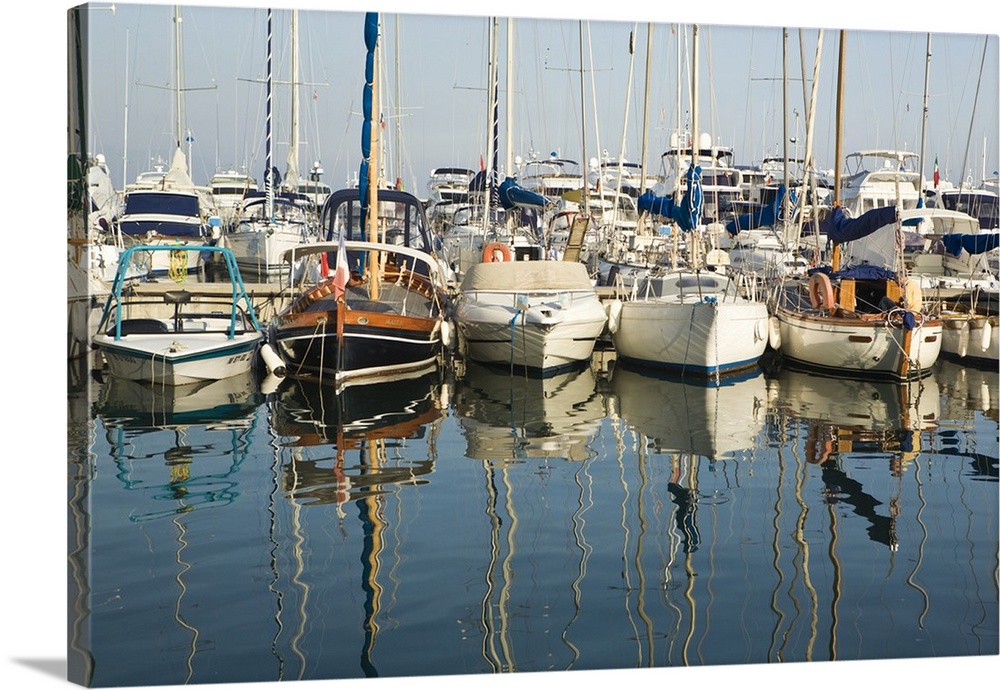 Boats and reflections in the marina area of Beaulieu sur Mer.  on the coastline in the South of France.
