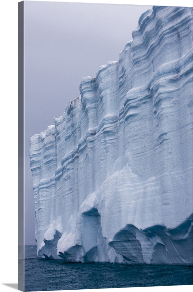 Norway, Svalbard, Nordaustlandet, Patterns in vertical ice face of Brasvellbreen Icefield on stormy summer morning