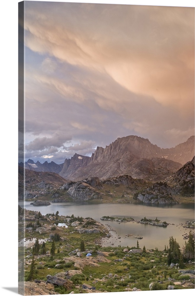 USA, Wyoming, Bridger National Forest, Bridger Wilderness. Sunset on Wind River Range and Island Lake with tent in foregro...