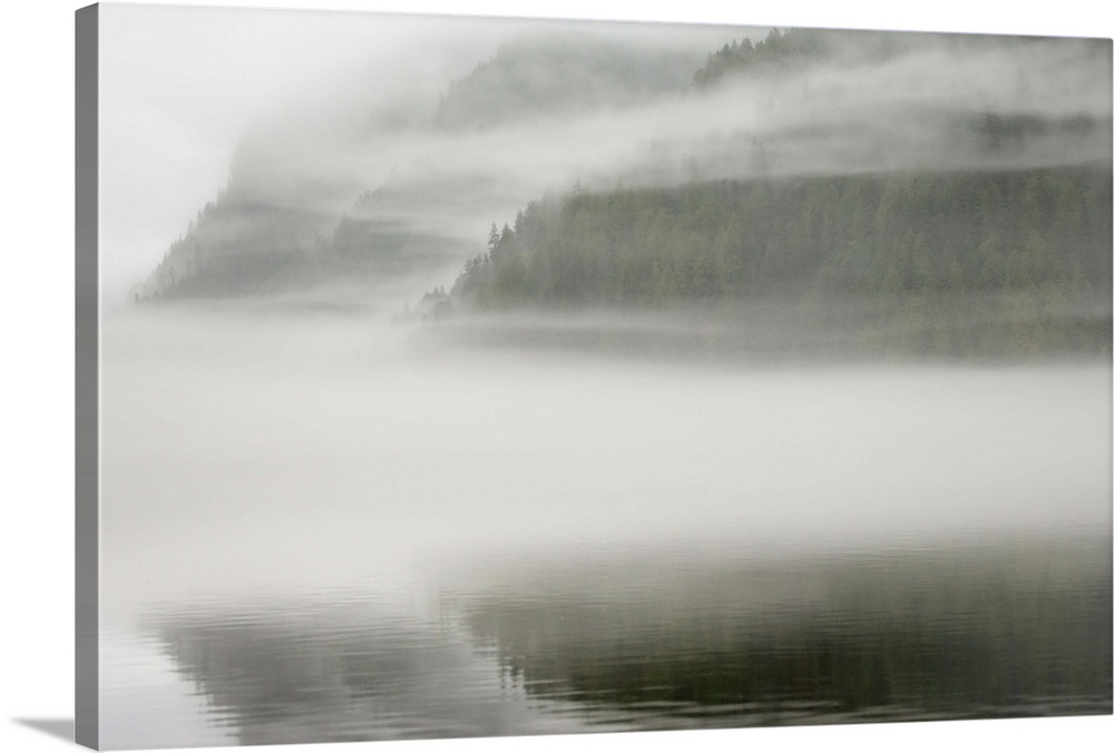 Canada, British Columbia, Calvert Island. Mist and fog shroud water and forested island. Credit as: Don Paulson / Jaynes G...