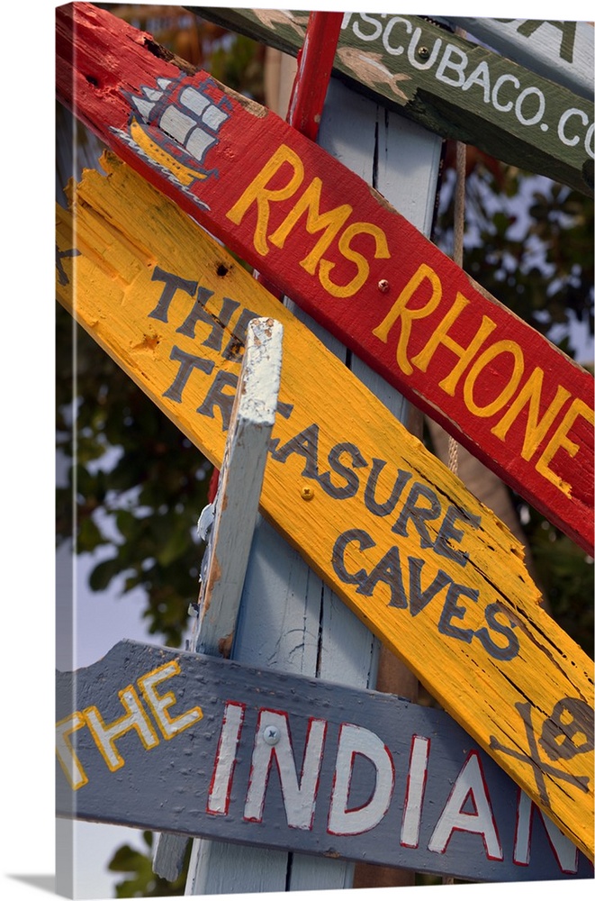 British Virgin Islands, Marina Cay. Colorful painted directional signs..