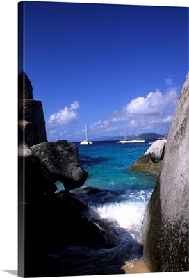 British Virgin Islands, Virgin Gorda, boulder rocks and boats in the choppy waters