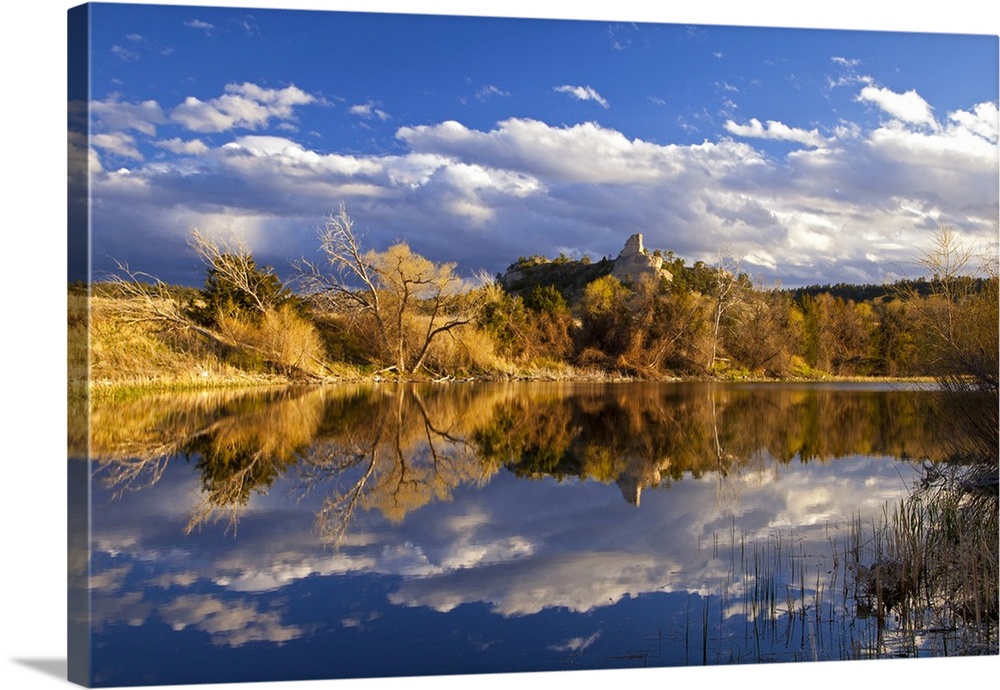 Pond reflects hills and bluffs at the Buffalo Creek WMA near Scottsbluff, Nebraska, USA