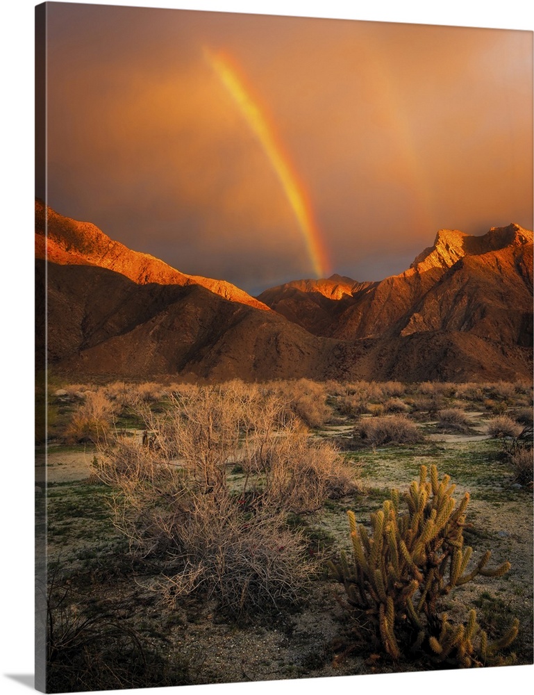 USA, California, Anza-Borrego Desert State Park. Rainbow over desert mountains at sunrise.