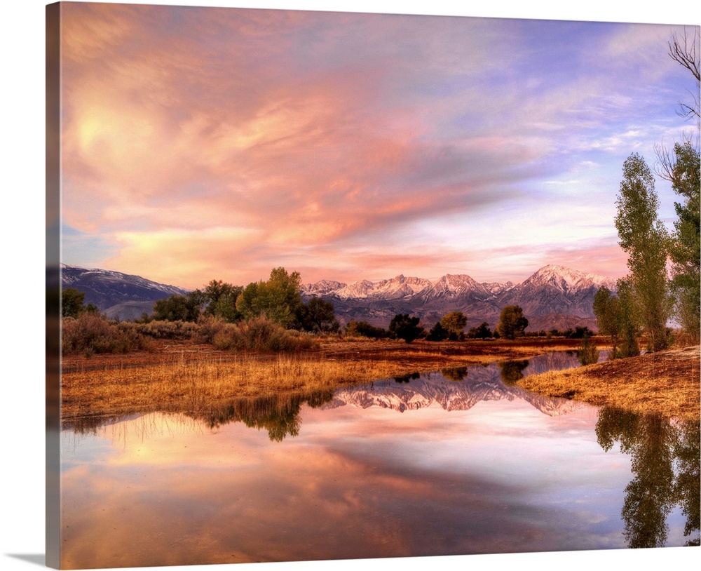 USA, California, Bishop. Sierra Nevada Range reflects in pond. Credit: Dennis Flaherty / Jaynes Gallery
