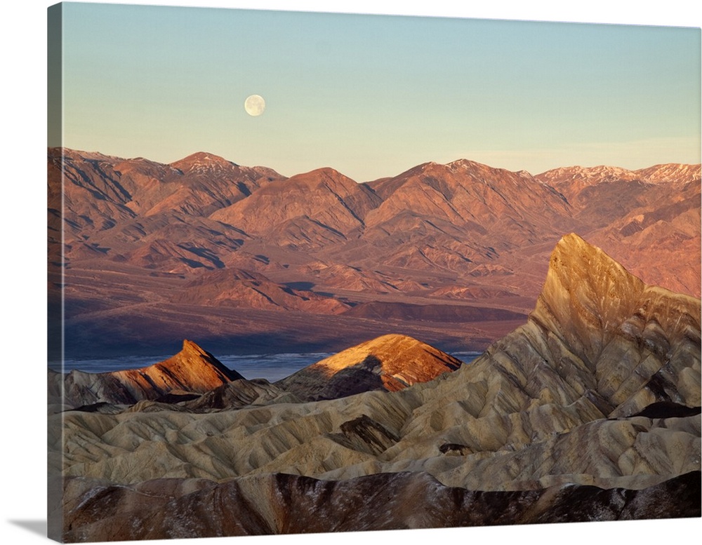 USA, California, Death Valley National Park, Moon setting at sunrise over Panamint Mountain Range