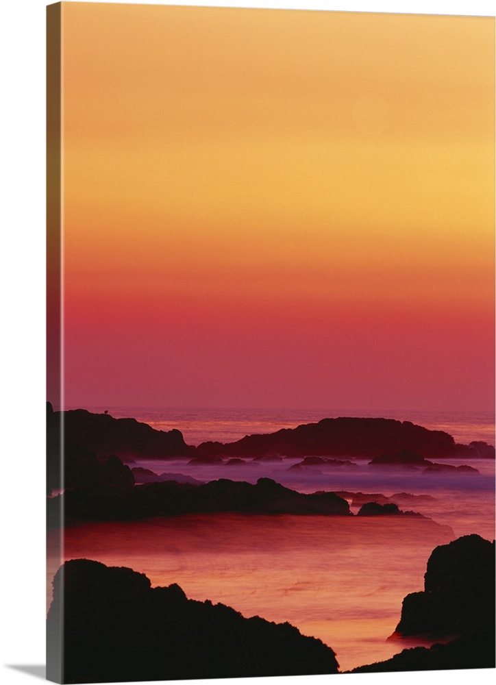 California, Monterey Peninsula, Pacific Grove, Offshore rocks at sunset