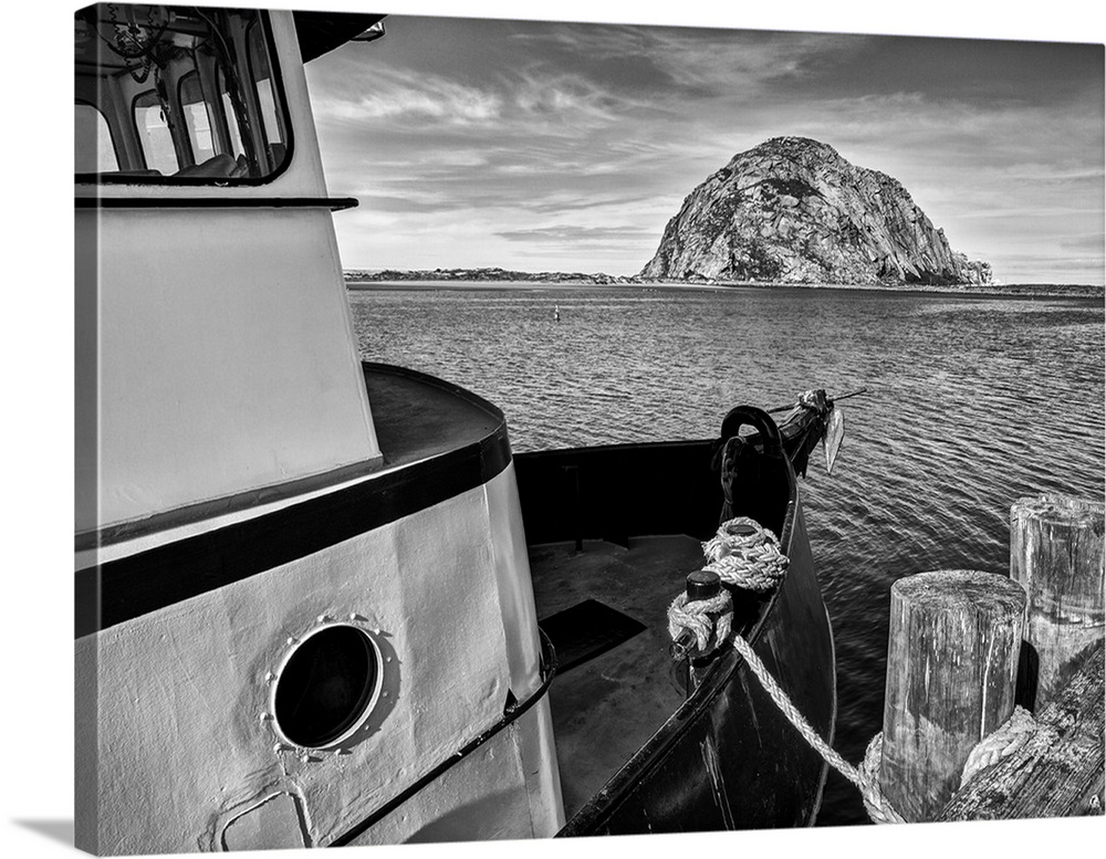 USA, California, Morro Bay, Fishing boat pointing at Morro Rock
