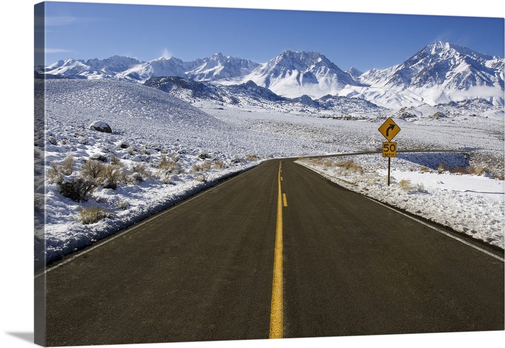 USA, California. Road into Sierra Nevada Mountains in winter. Credit: Dennis Flaherty / Jaynes Gallery