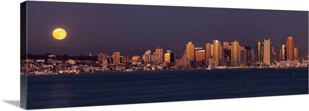 USA, California, San Diego, Panoramic view of full moon rising over city with sunset glow on buildings