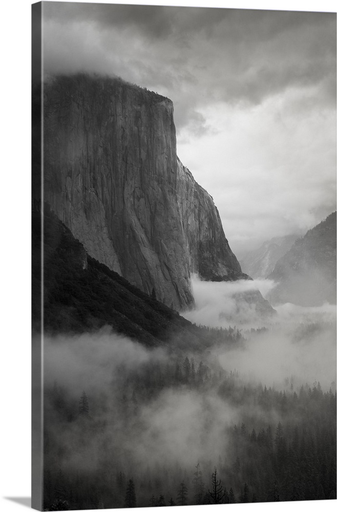 North America, USA, California, Yosemite National Park.  Black and White image of El Capitan with swirling mist through th...