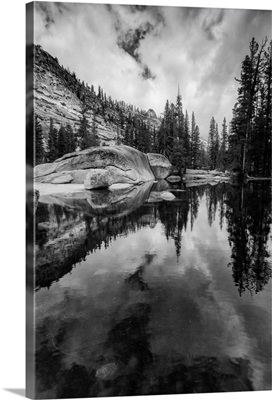 California, Yosemite National Park. granite outcropping with boulders, clouds, lake