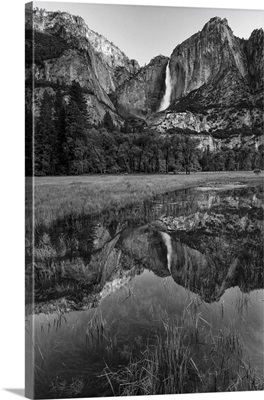 California. Yosemite National Park. Upper Yosemite Falls with reflection in a pool