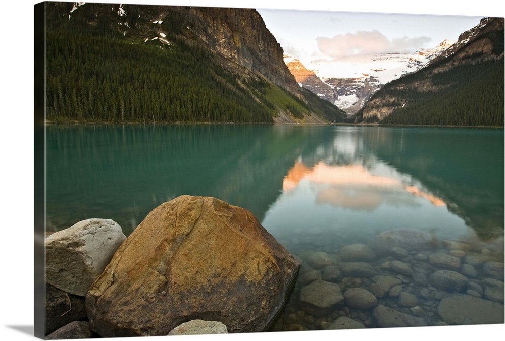 North America, Canada, Alberta, Banff National Park, Rocky Mountains and boulders reflected in Lake Louise, June