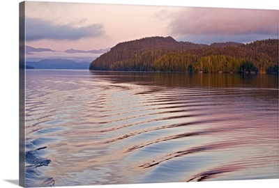 Canada, British Columbia, Calvert Island. Boat wake in water at sunset