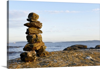 Canada, British Columbia, Russell Island. Rock inukshuk in front of Salt Spring Island.