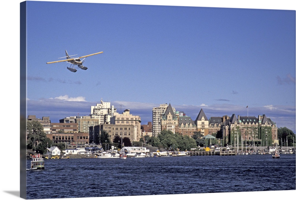NA, Canada, BC, Victoria Harbor.Kenmore Air float plane makes final approach