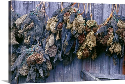 Canada, Nova Scotia, Hunts Point. Bait bags on fish shed wall