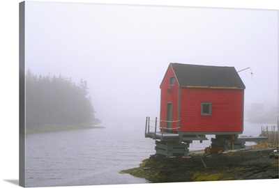 Canada, Nova Scotia, Stonehurst. Red fishing shed in fog