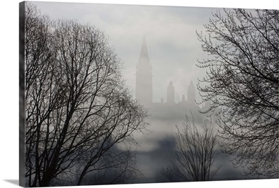 Canada, Ontario, Parliament Buildings seen through fog on Ottawa River