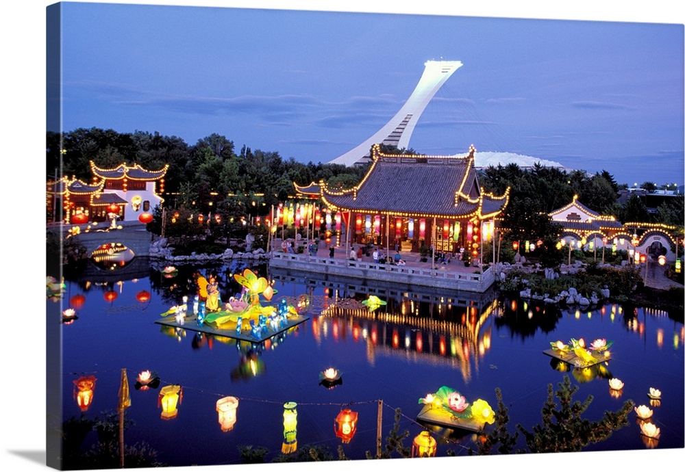 North America, Canada, Quebec, Montreal. Jardin Botanique, Illuminated Chinese Gardens with view of Olympic Stadium